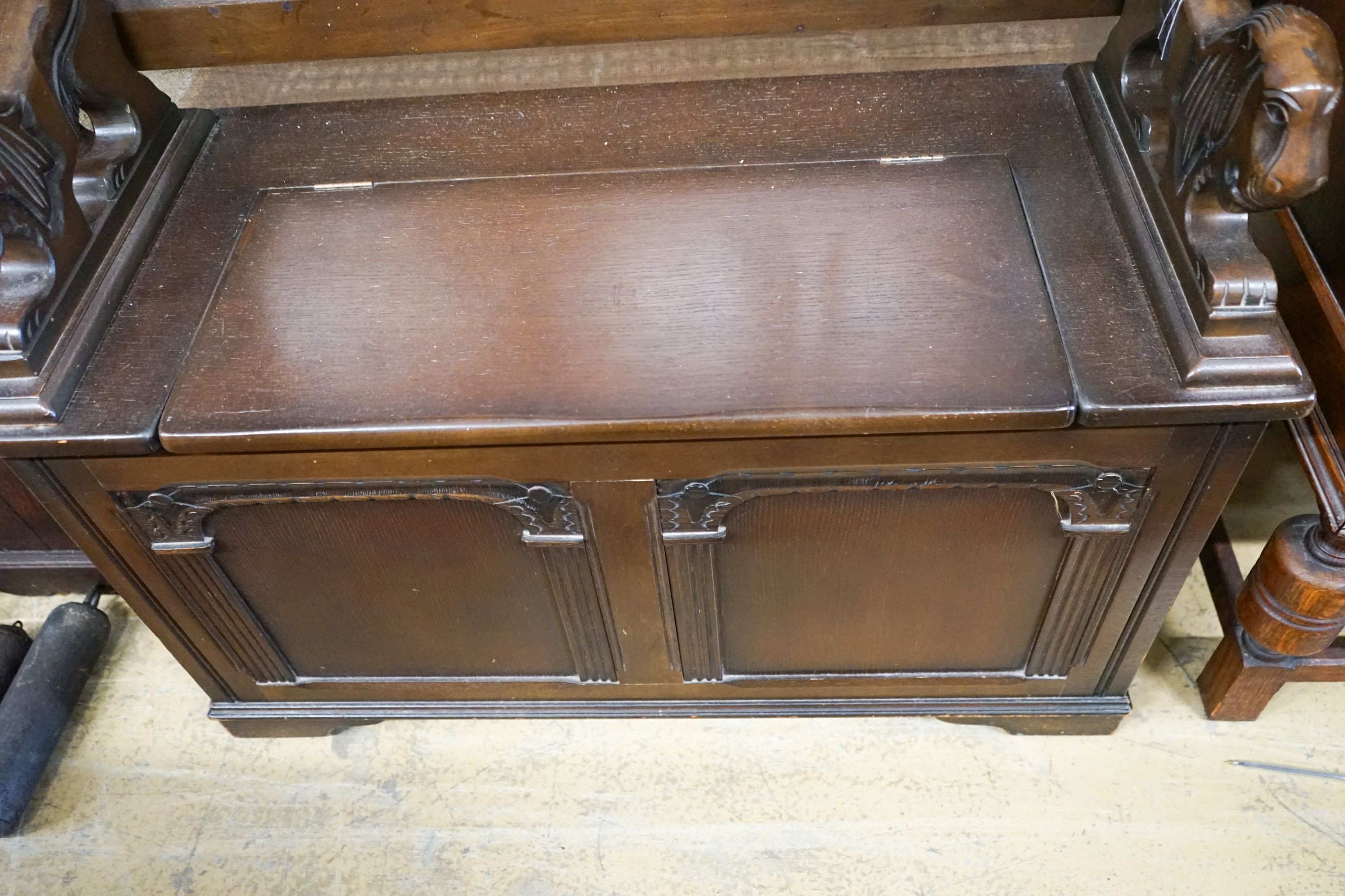 An 18th century style oak monks bench together with a 1920's oak sideboard